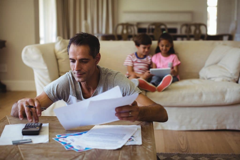 Worried dad thinking about family finances